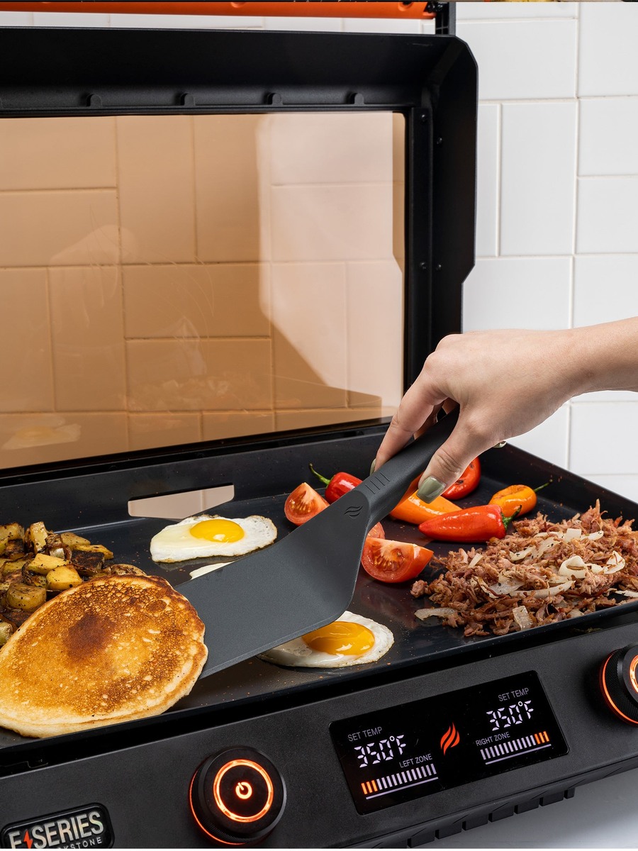 Electric griddle utensil set Blackstone E-Series 4 pieces in use