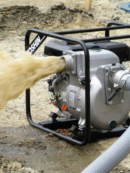 Transferring water with a Blue Bird engine-driven water pump.
