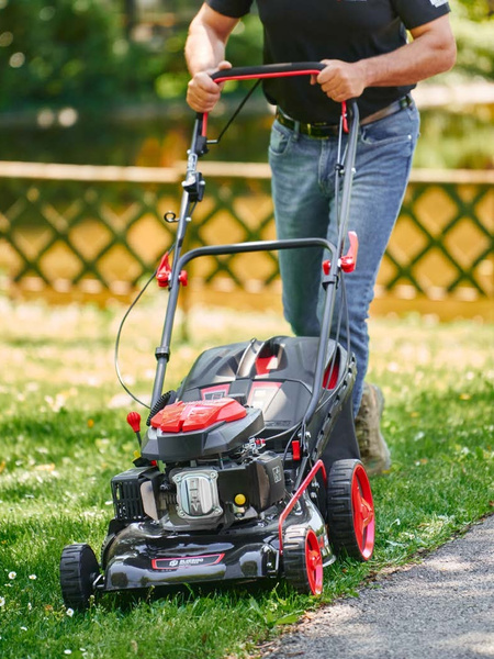 Lawn mowing with a Blue Bird lawnmower.