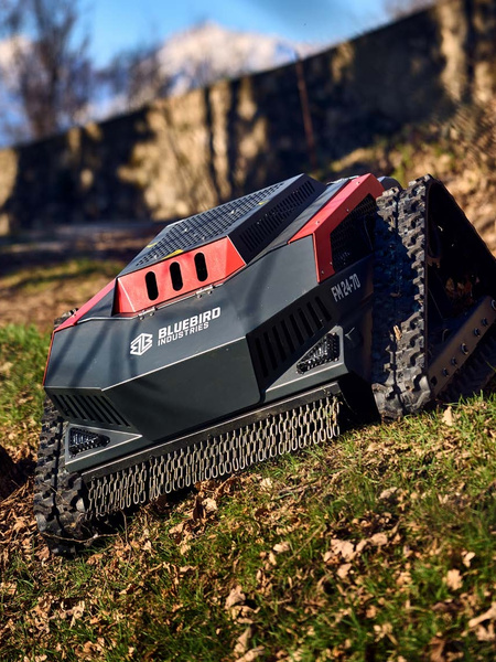 Blue Bird FM 24-70 brush mower in use.